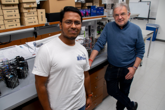 Photo of Md Mostafijur Rahman and Radu Marculescu standing in a research lab